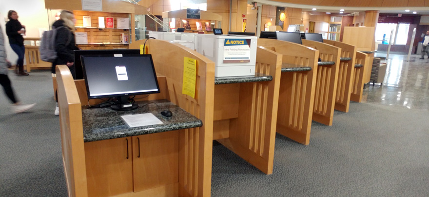 Printers on first floor of library on and near the circulation desk