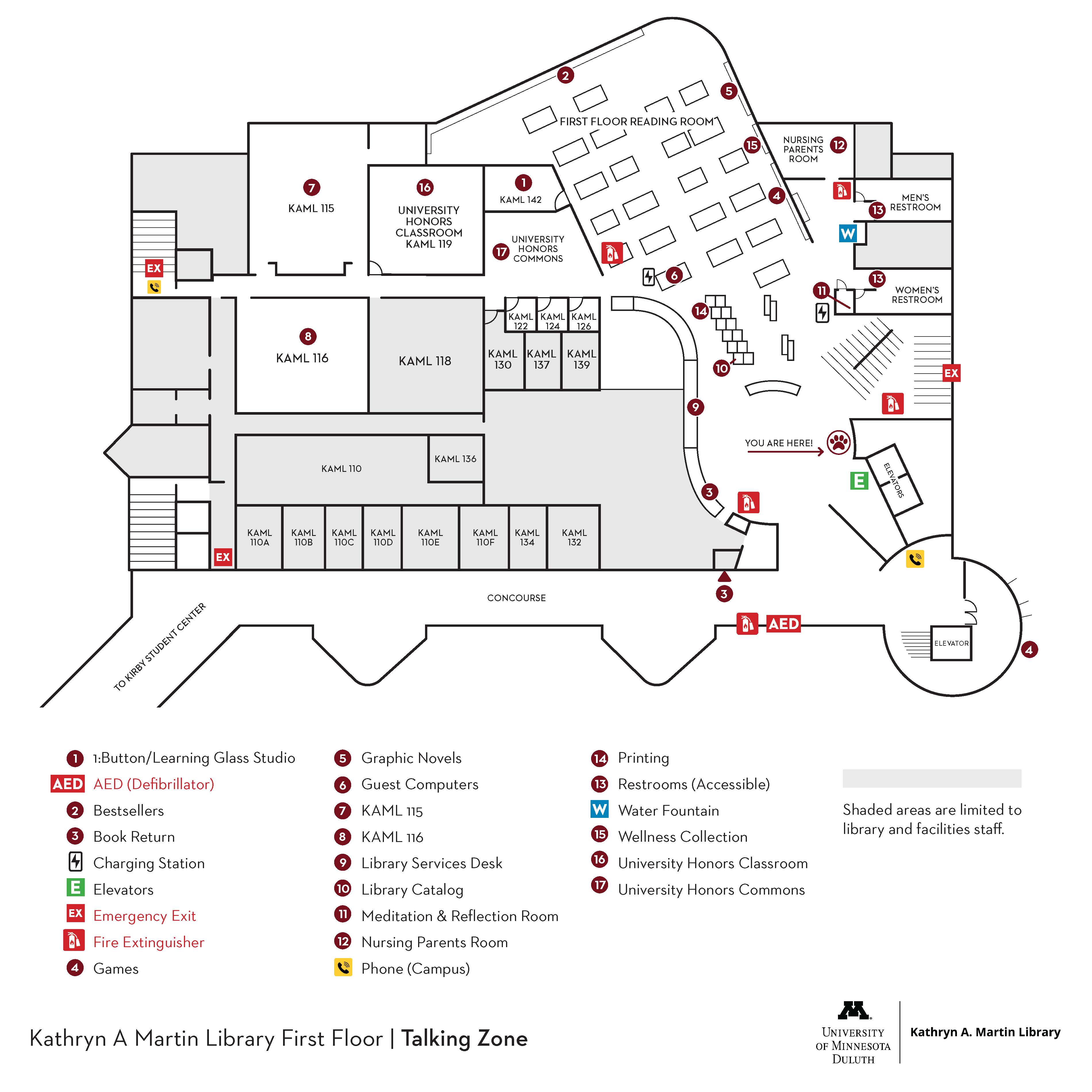 Map of the first floor of Kathryn A. Martin Library at the University of Minnesota Duluth, indicating room layouts, facilities like restrooms and elevators, and emergency exits.