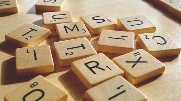 scrabble tiles laid out on a table