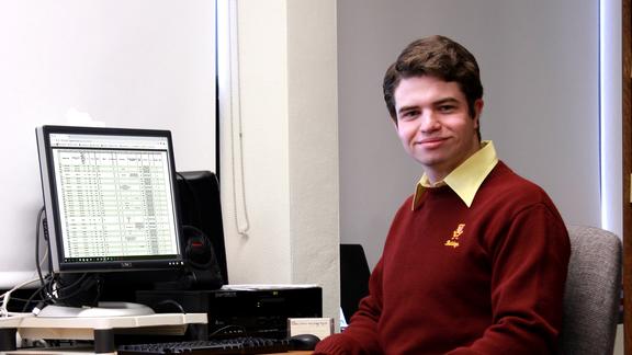 Student Tucker Nelson Sits At His Desk