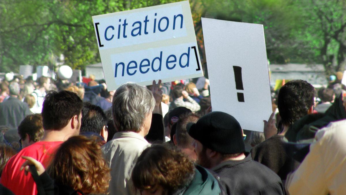 Citations needed protest sign
