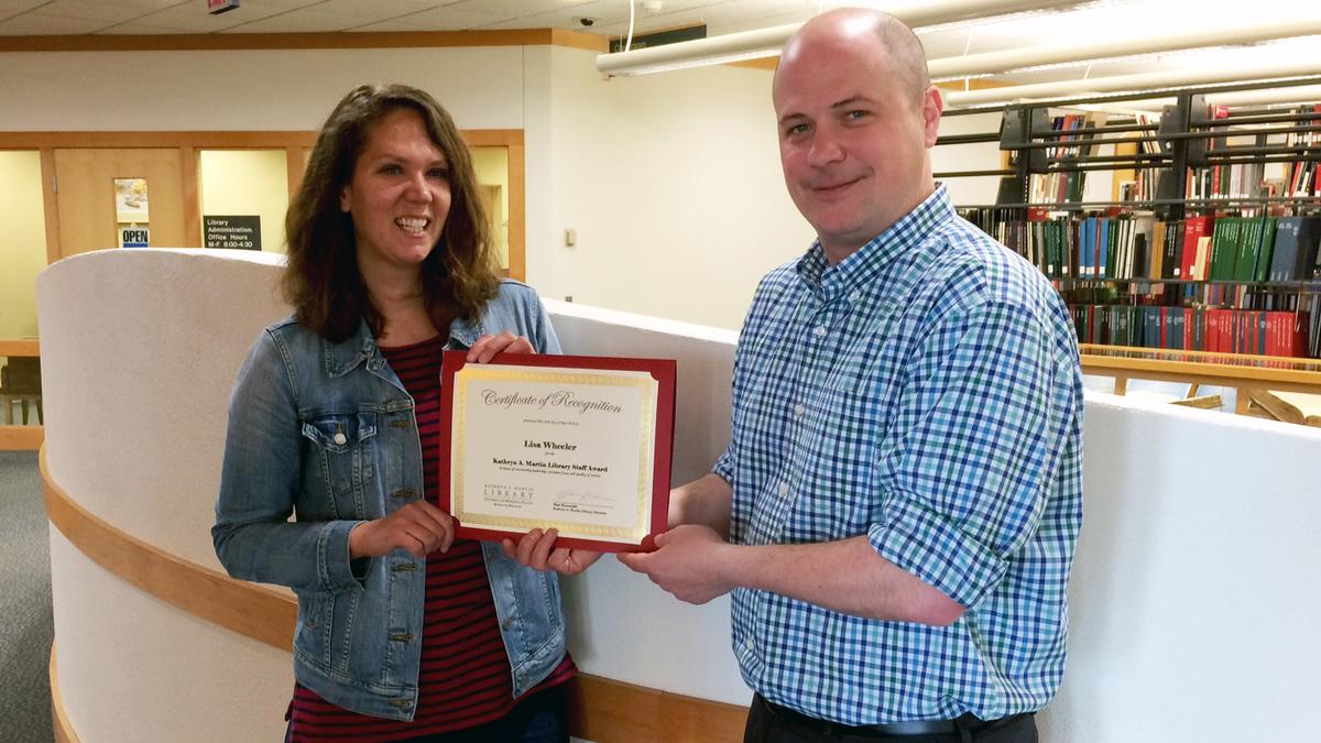 Matt Rosendahl presents certificate to Lisa Wheeler
