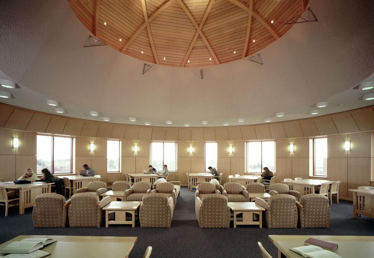 Students studying in the Library's Fourth Floor Rotunda Reading Room