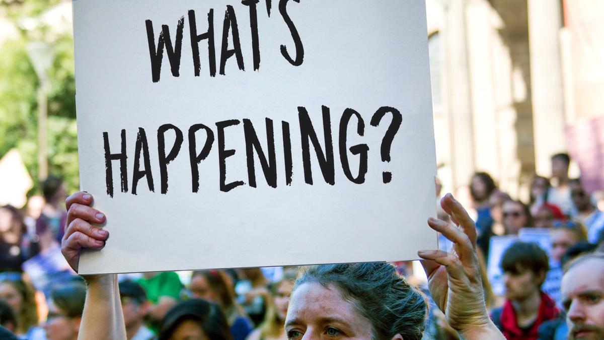 What's happening protest sign