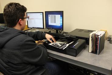 student worker scanning documents